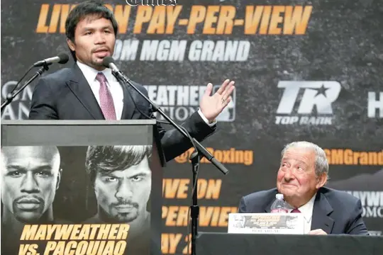  ??  ?? AFP FILE PHOTO Manny Pacquiao and Top Rank Promotions chief Bob Arum (right).