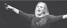  ?? THEO WARGO, GETTY IMAGES ?? Adele returns to familiar territory: a front-runner for record of the year with Hello.