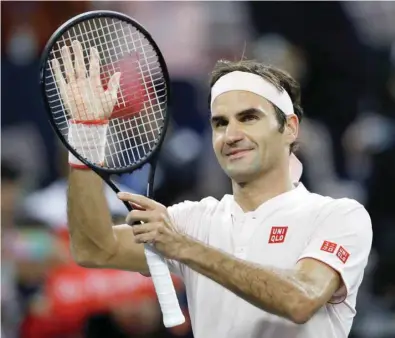  ?? (Reuters) ?? Roger Federer of Switzerlan­d celebrates his victory against Daniil Medvedev of Russia during their Shanghai Masters match yesterday.