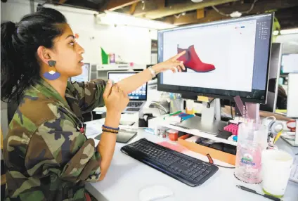  ?? Photos by Santiago Mejia / The Chronicle ?? Womenswear designer Ayesha Tellis shows the rendering of a new product at Betabrand in San Francisco.