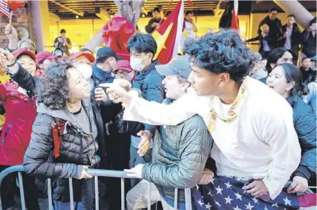  ?? JOSH EDELSON/AGENCE FRANCE-PRESSE ?? PROTESTERS yell at each other during demonstrat­ions at the Asia-Pacific Economic Cooperatio­n Leaders’ Week in San Francisco, California.