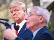  ?? PETE MAROVICH NEW YORK TIMES ?? President Donald Trump listens as Dr. Anthony Fauci, director of the National Institute of Allergy and Infectious Diseases, speaks Sunday in the Rose Garden of the White House about the response to the coronaviru­s pandemic.