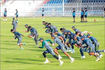  ?? AFP ?? Pakistan’s cricketers warm up during a practice session on Tuesday, ahead of their first one-day internatio­nal (ODI) cricket match against New Zealand.