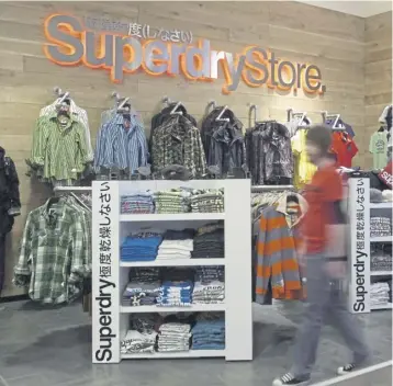  ?? ?? ↑ Superdry has grown to become a familiar sight on the UK high street. Picture: Greg Macvean