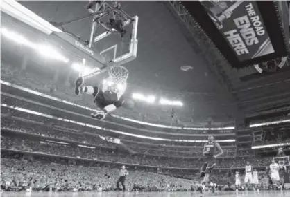  ?? Ronald Martinez, Getty Images ?? Senior swingman Niels Giffey completes a UConn fast break with a dunk against the top-ranked Florida Gators during the Final Four opener Saturday atmammoth AT&T Stadium in Arlington, Texas. Giffey had 11 points.