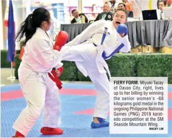 ?? MACKY LIM ?? FIERY FORM. Miyuki Tacay of Davao City, right, lives up to her billing by winning the senior women's -68 kilograms gold medal in the ongoing Philippine National Games (PNG) 2018 karatedo competitio­n at the SM Seaside Mountain Wing.