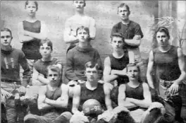  ?? Herkimer 9 Foundation ?? This photo of the first Herkimer YMCA team, with Lambert Will seated in the middle of the second row, is pointed to as evidence that this team played before the Naismith team in Springfiel­d, Mass., did, based on the date seen on the basketball.