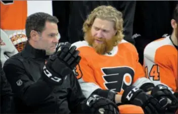  ?? SUBMITTED PHOTO – ZACK HILL ?? During the Flyers annual team photo shoot at Wells Fargo Center Wednesday morning, Jake Voracek, right, might have been asking interim head coach Scott Gordon the meaning of life in Gary Bettman’s NHL.