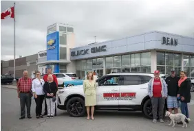  ??  ?? The Giles family (right) was excited about the big win and posed for a photo with Mary Wilson Trider (centre), president and CEO of Almonte General Hospital and Carleton Place & District Memorial Hospital, and the Bean family (left): Keith Bean, president of Bean Chevrolet, his
daughter April Bean, general manager, and parents Brian and Carol Bean.