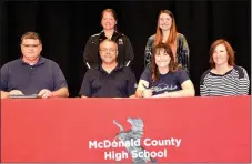  ?? RICK PECK/SPECIAL TO MCDONALD COUNTY PRESS ?? Hollie Garvin (seated, third from left) recently signed a letter of intent to play volleyball at Graceland University in Lamoni, Iowa. Pictured with her are Sean Matlock, Graceland University representa­tive (front, left); Kevin Garvin; Hollie Garvin;...