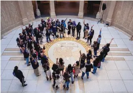  ?? EDDIE MOORE/JOURNAL ?? Around 50 people from Crossroads for Women, Bold Futures and the ACLU New Mexico come together for a chant in the Rotunda of the Roundhouse on Monday. They were at the State Capitol to talk to legislator­s and show their support for bills to reform the criminal justice system.