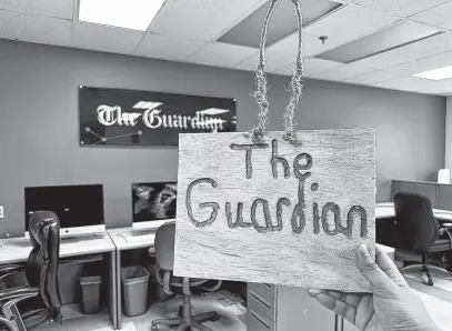  ?? ?? The Guardian office received a wooden sign with the name of the business carved onto it. THINH NGUYEN • THE GUARDIAN