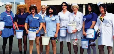  ??  ?? Light-hearted: Members of the charity dressed as female nurses on their annual fundraiser