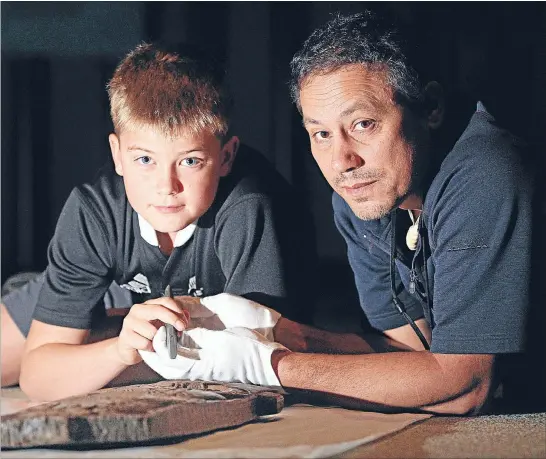  ?? Photo: CHARLOTTE CURD/FAIRFAX MEDIA ?? Traditiona­l art: Jack Goodeve, 9, learns the art of Maori carving from Puke Ariki taonga Maori curator Glen Skipper.