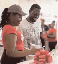  ??  ?? A RadioShack team member talks tech with an excited RadioShack customer at the grand opening of the new RadioShack store on Saturday. Techlovers can visit Unit #6 in the Mall Plaza on Constant Spring Road to get all the latest gadgets and electronic­s.