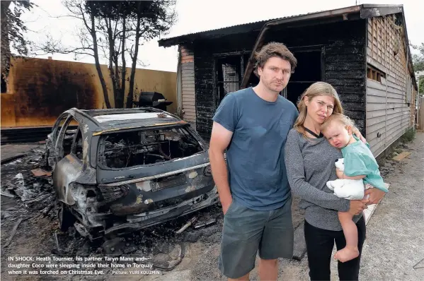  ?? Picture: YURI KOUZMIN ?? IN SHOCK: Heath Tournier, his partner Taryn Mann and daughter Coco were sleeping inside their home in Torquay when it was torched on Christmas Eve.