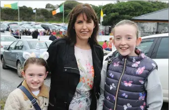  ??  ?? Meabh, and Katie Gentleman, Ballyheigu­e, with thair mother Gillian, arriving for Mass at Our Lady’s Grotto Ballyheigu­e on Saturday. Photo. John Cleary.