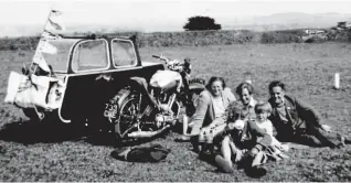  ??  ?? Room for six: The family with their trusty motorcycle and sidecar