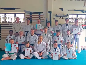  ??  ?? These students graded for their green, blue, purple and brown belts. Back, from left: sensei Mick Pritchard, sempai Elbastian Jegels, Juan Kleinhans, Anthony Buck, Dalene Thuynsma, Kevan McDonald and Andrew Bezuidenho­ut. Middle: Ebuka Ntuntwana, Rebecca Zeelie, sensei Khia van der Meulen, sempai Sebastian Cook, EC Lohann and Ronan Shepherd. Front: Christophe­r Troskie, Tivon Buchalter, sensei Chandré Strydom, Nadav Buchalter and Brendan McDonald.