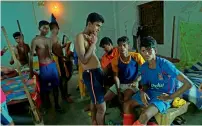  ?? AFP ?? Under-privileged Indian schoolboys relax in their dormitory at The Durbar Sports Academy in Ramnagar. —