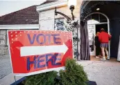  ?? MIGUEL MARTINEZ / THE ATLANTA JOURNAL-CONSTITUTI­ON ?? Voters enter the Park Tavern precinct in Piedmont
Park in Atlanta during the Georgia presidenti­al primary elections in Atlanta on Tuesday.