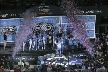  ?? AP PHOTO/PHELAN M. EBENHACK ?? Ricky Stenhouse Jr., center right, celebrates in Victory Lane after winning the NASCAR Daytona 500auto race at Daytona Internatio­nal Speedway, Sunday, Feb. 19, 2023, in Daytona Beach, Fla.