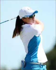  ?? Maddie Meyer/Getty Images ?? Leona Maguire of Team Europe plays her shot from the third tee Monday at the Solheim Cup at the Inverness Club in Toledo, Ohio.