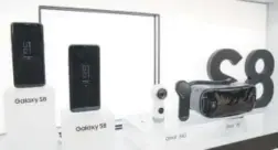  ??  ?? The Galaxy S8, which comes in two sizes, left, is displayed with the Gear 360 camera, center, and the Gear VR headset. The Associated Press