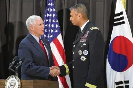  ?? LEE JIN-MAN / AP ?? Vice President Mike Pence is greeted by Gen. Vincent Brooks, commander of the United Nations Command, U.S. Forces Korea and Combined Forces Command, in Seoul, South Korea on Sunday. Pence is on a 10-day trip to Asia and Australia.