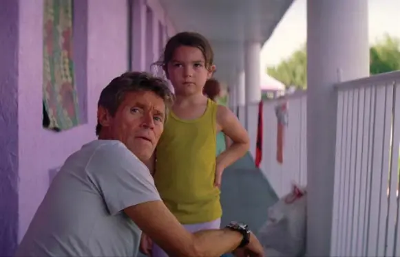  ?? A24 ?? Willem Dafoe as Bobby, a motel manager with a heart, with stellar Brooklynn Prince, who plays the 6-year-old daughter of blue-haired grifter Halley in The Florida Project.