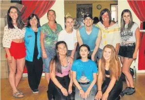  ??  ?? Strike a pose Staff members sneak a photo with Adam Garcia