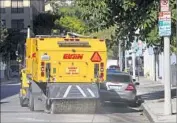  ?? Gina Ferazzi Los Angeles Times ?? A STREET SWEEPER in Hollywood, where roughly 30,000 street-sweeping tickets are given out per year.