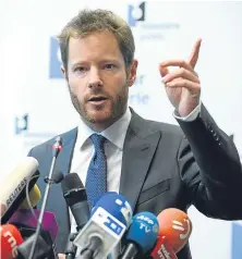  ?? Pictures: Getty/AP. ?? The spokesman for the prosecutor’s office in Brussels, Gilles Dejemeppe, left, speaks to the media after Carles Puigdemont handed himself in to police in Brussels.