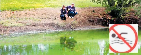  ?? Photo / Stuart Munro ?? Dudding Lake has high levels of blue/green algae and a sign warns against contact with the water.