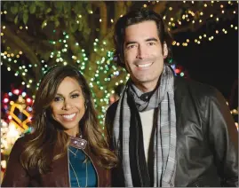  ??  ?? Taniya Nayak and Carter Oosterhous­e host “The Great Christmas Light Fight”