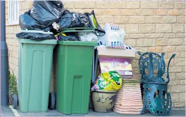  ?? Picture: GETTY ?? WASTE: Services such as bin collection­s are cut but council bosses pick up big salaries