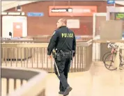  ?? ANDA CHU — STAFF ARCHIVES ?? A BART police officer patrols the Downtown Berkeley BART Station in Berkeley.