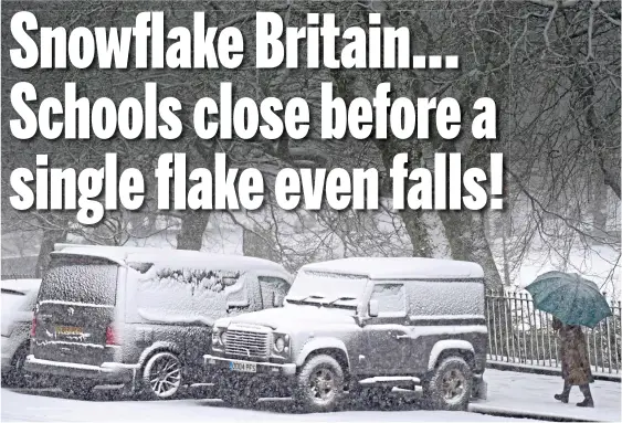  ?? ?? We get the drift: Protected by a brolly, a walker trudges past snow-covered cars as Derbyshire bears the brunt of the weather