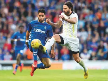  ?? AP ?? Rangers’ Daniel Candeias (left) vies for the ball with Maribor Marko Suler during the Europa League game. Rangers drew 0-0 to knock out Maribor on aggregate.