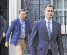  ?? Aaron Chown The Associated Press ?? British Foreign Secretary Jeremy Hunt leaves 10 Downing Street in London on Saturday following a meeting about a British oil tanker that was captured by Iran.