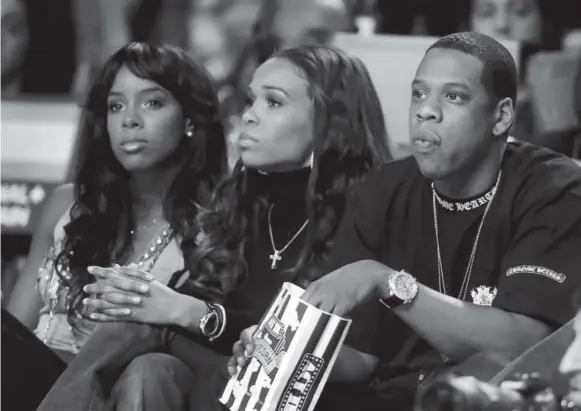  ?? Denver Post file ?? Jay Z and Destiny’s Child singers Kelly Rowland, left, and Michelle Williams watch the NBA All-star Game in Denver in 2005.