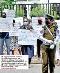  ?? PIC BY NISAL BADUGE ?? SJB supporters seen holding placards outside the Prime Minister’s office at Flower Road against the recent remark made by Premier Mahinda Rajapaksa about SJB leader Sajith Premadasa and his wife not bearing a child