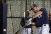  ?? MORRY GASH — THE ASSOCIATED PRESS ?? Milwaukee Brewers’ Erik Kratz hits during a spring training baseball workout Thursday in Phoenix.