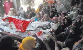  ?? Iram Asim ?? The Associated Press Pakistani women mourn Monday beside the body of a relative killed in Sunday’s fuel tanker fire incident at Ahmad Pur Sharqia near Bahawalpur, Pakistan.
Pakistani Prime Minister Nawaz Sharif cut short a trip abroad to rush to the...