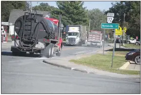  ?? (NWA Democrat-Gazette/J.T. Wampler) ?? Commercial trucks pass through the intersecti­on of Arkansas 59 and Arkansas 72 in Gravette on Friday. Truck traffic increased in the area after the Bella Vista Bypass opened. Visit nwaonline.com/ photo for today’s photo gallery.