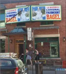  ??  ?? One would never know from its appearance that Fairmount Bagel, left, is one of Montreal’s world famous bagel shops. But its rough and tumble exterior is part of its charm.