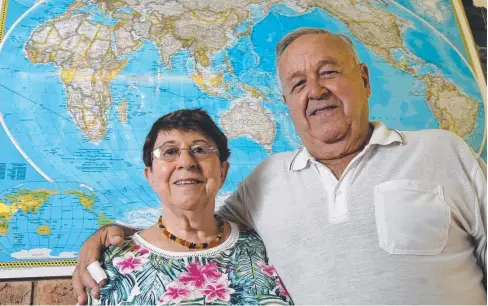  ??  ?? WORLDLY WISE: Eddie and Ute Haring of Smithfield spent 12 years sailing around the world with their children before settling in Cairns. BELOW: The couple pictured during their epic global voyage with their children Katja (centre), Iris and Marco.