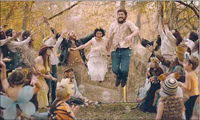  ??  ?? Blaze Foley (Ben Dickey) and Sybil Rosen (Alia Shawkat) jump the broom in this scene from Ethan Hawke’s Blaze, a story about what you have to give up to follow your dream.