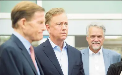  ?? Ned Gerard / Hearst Connecticu­t Media ?? Governor Ned Lamont attends a news conference at the Stratford rail station on June 21.