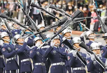  ?? Chiang Ying- ying Associated Press ?? TAIWAN’S MILITARY honor guard performs during National Day on Oct. 10 in Taipei. Chinese state media have criticized U. S. Secretary of State Michael R. Pompeo over his decision to send a diplomat to the island.